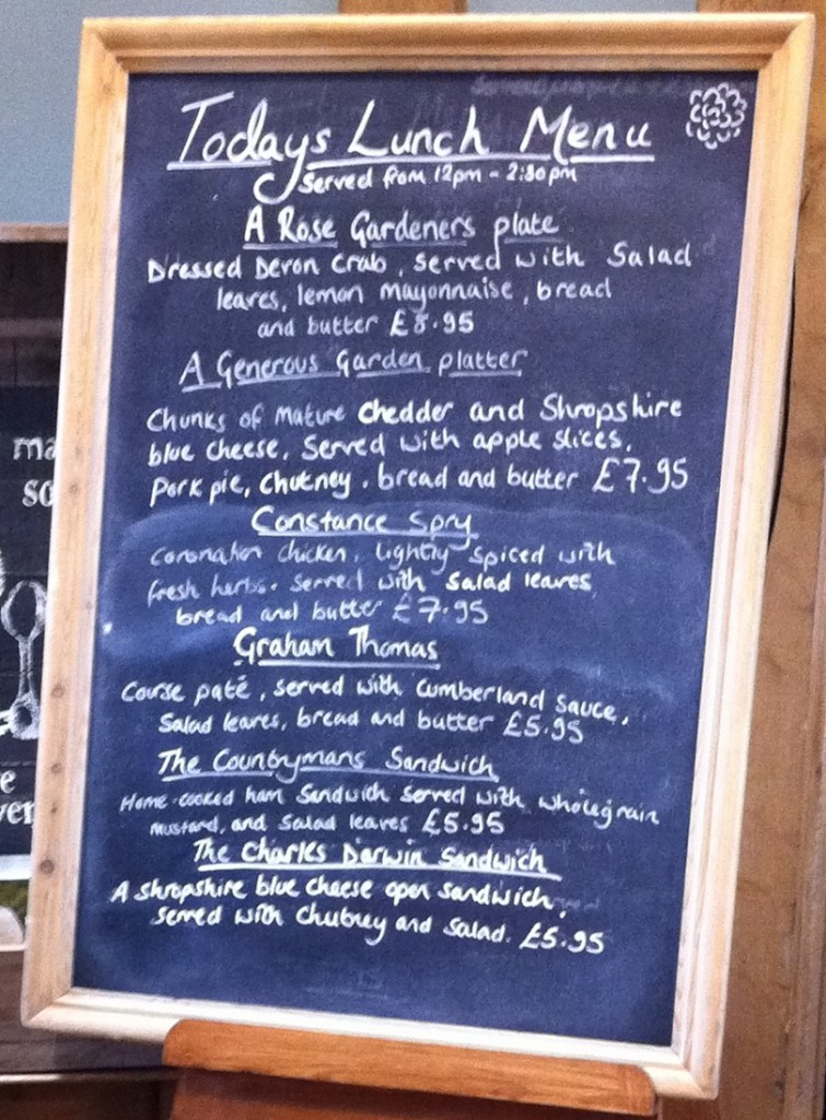Blackboard with 'Today's Lunch Menu' at David Austen's Plant Centre Photograph of a free-standing blackboard inside the door of the tearooms at David Austen's Plant Centre. Written on the blackboard in chalk is the title 'Today's Lunch Menu' with a selection of six main courses: A Rose Gardeners plate; A Generous Garden platter; Constance Spry; Graham Thomas; The Countrymans Sandwich; The Charles Darwin sandwich.